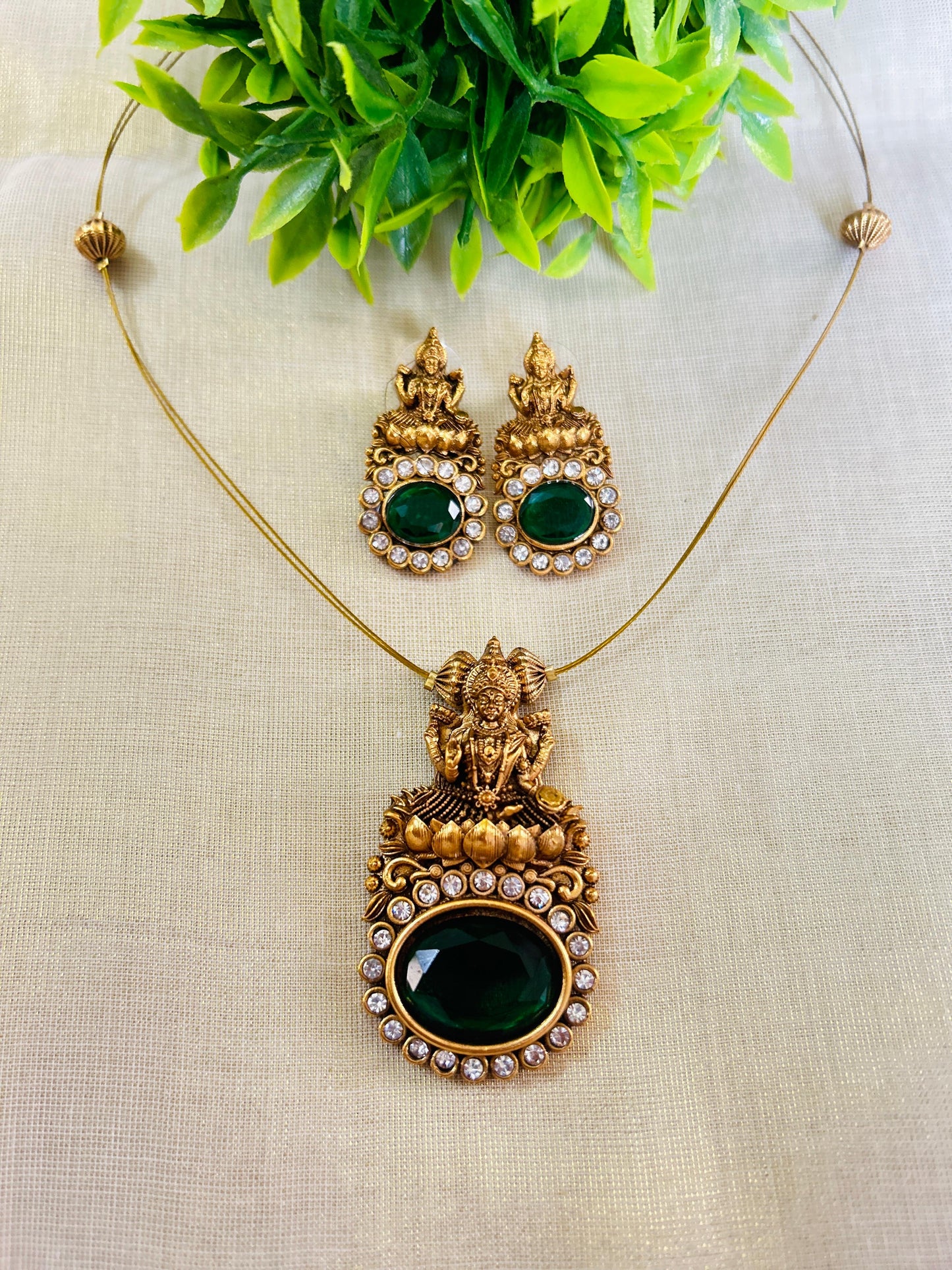 Invisible chain with Green AD stone lakshmi pendant